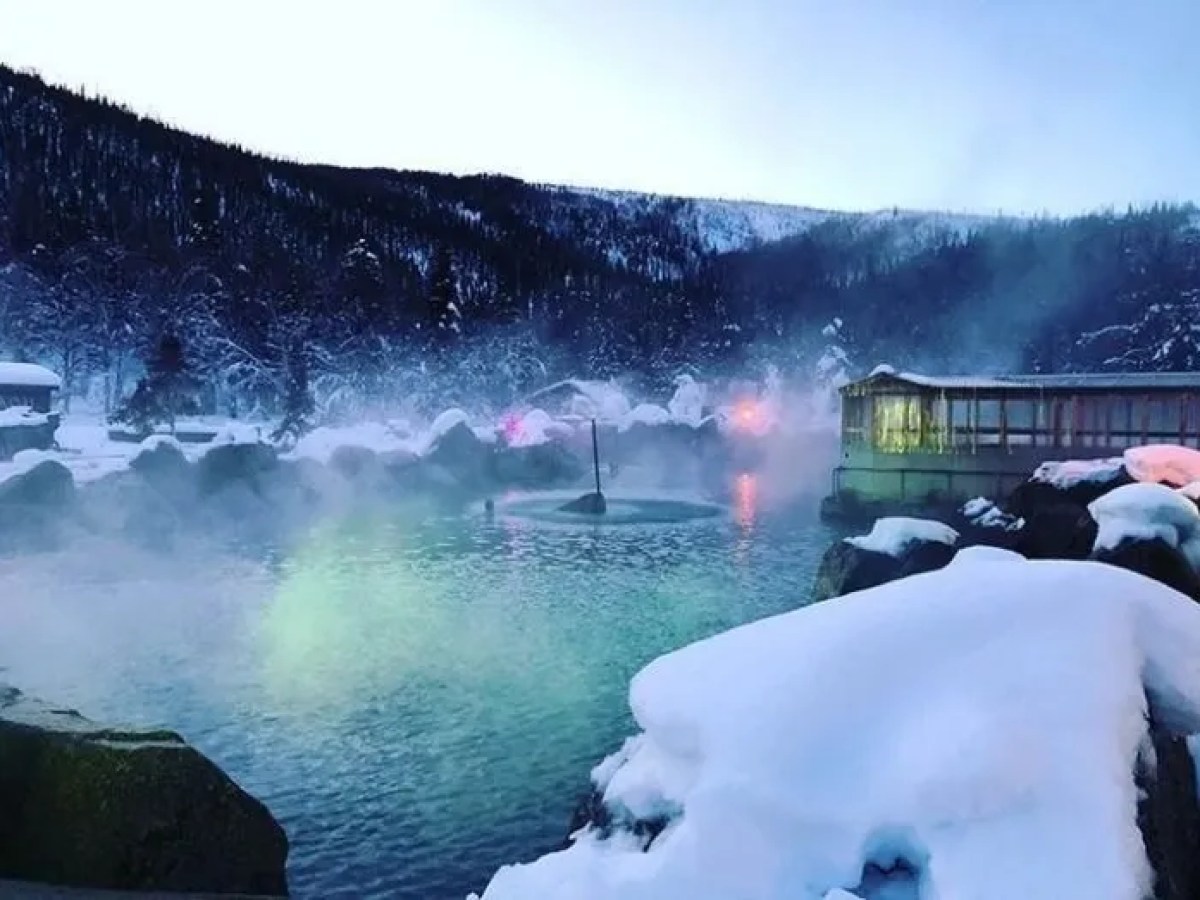 Snow-covered Chena landscape with water surrounded with rocks