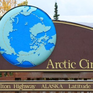 Arctic Circle sign mounted on building along Dalton Highway Alaska