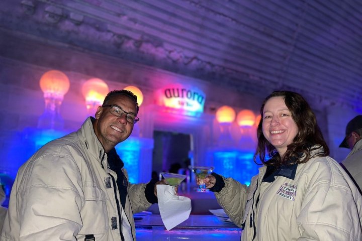 a couple of people that are standing in front of a stage