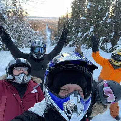 a couple of people that are standing in the snow