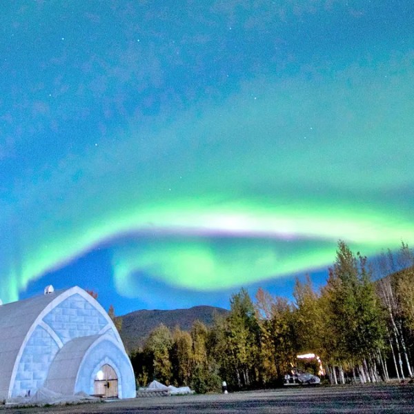 Fairbank Ice Museum with northern lights glowing above in Alaska