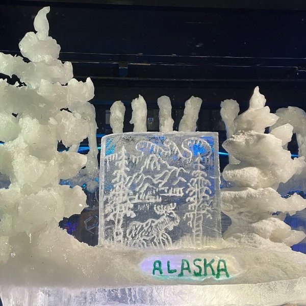Ice sculpture featuring Alaska-themed design on display