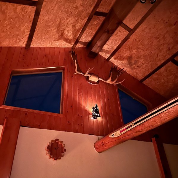 Cozy guest room at Chena Hot Springs Resort with warm lighting and comfortable furnishings