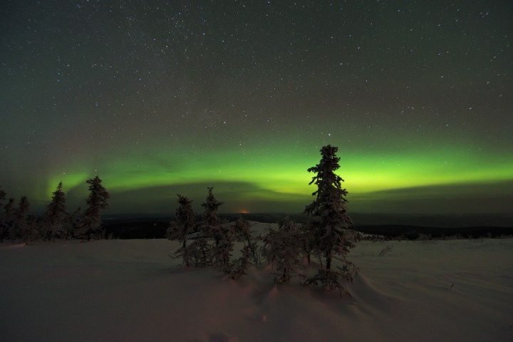 a man with a sunset in the background