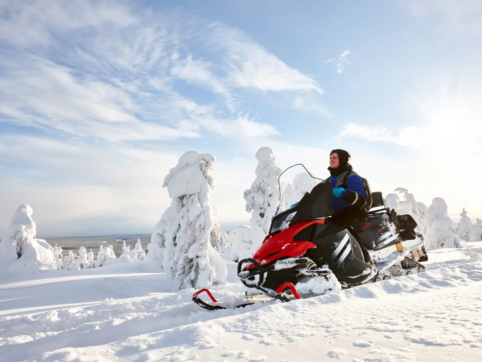 Snowmobile tour through snow-covered trails near Fairbanks Alaska