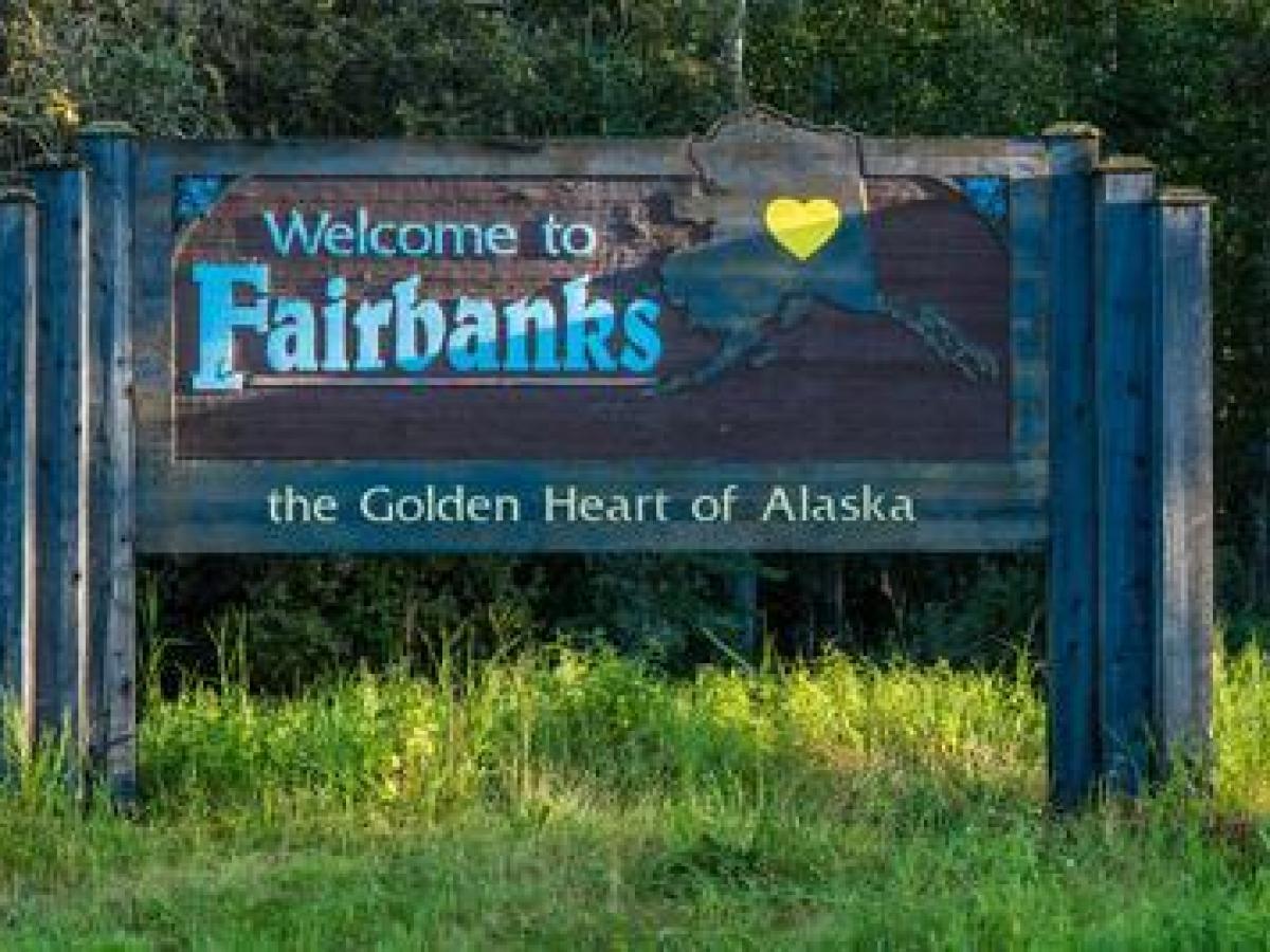 Sign reads 'Welcome to Fairbanks, the Golden Heart of Alaska' with a yellow heart on Alaska's silhouette.